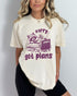 Model wearing ivory color shirt with 'Sorry Got Plans' raccoon watching TV graphic design